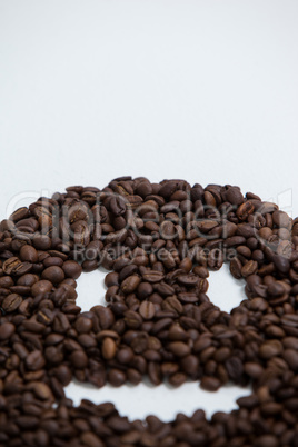 Coffee beans forming smiley face