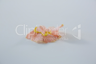 Yellow color pencil shaving on a white background