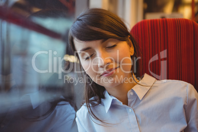 Businesswoman sleeping while travelling