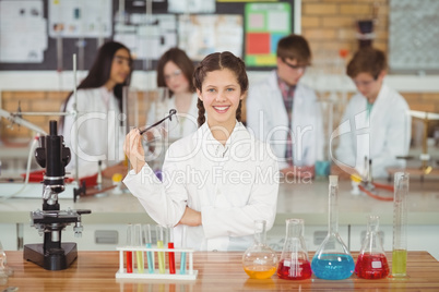 Portrait of smiling schoolgirl in laboratory