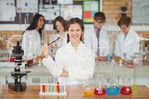 Portrait of smiling schoolgirl in laboratory