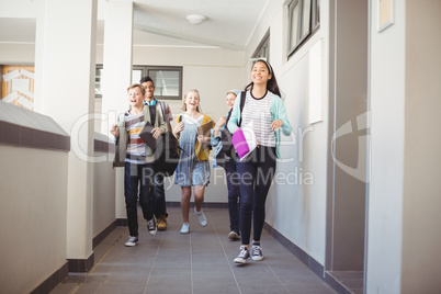 Group of classmate running in corridor