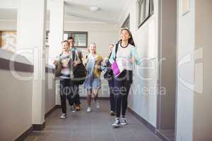 Group of classmate running in corridor