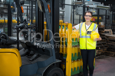 Portrait of female worker standing in factory