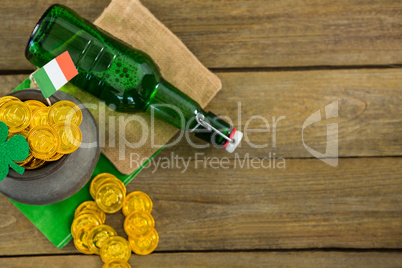 St. Patricks Day shamrock, flag, beer bottle and pot filled with chocolate gold coins