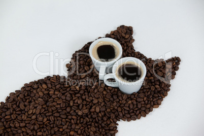 Coffee beans and cups forming owl