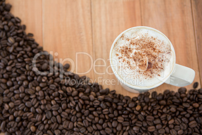 Coffee mug with roasted coffee beans