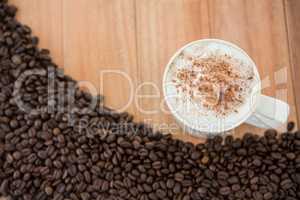 Coffee mug with roasted coffee beans