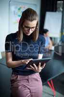 Business executive using digital tablet in office