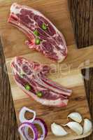 Blade chop, onions and garlic on wooden board