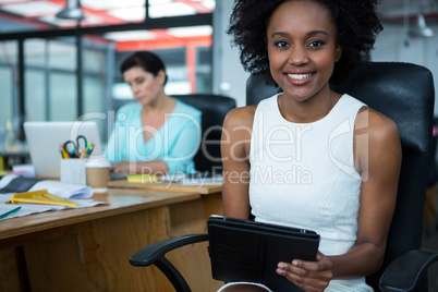 Female graphic designer using digital tablet