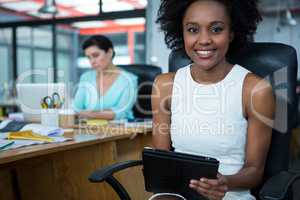 Female graphic designer using digital tablet