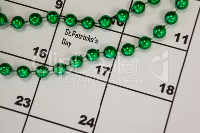 St. Patricks Day beads kept on calendar