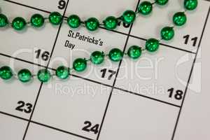 St. Patricks Day beads kept on calendar