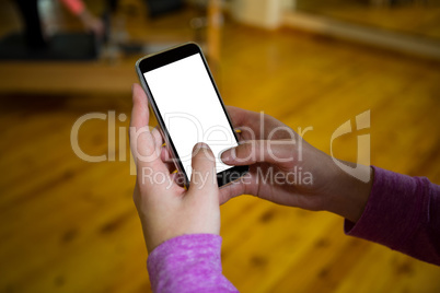 Hand on a woman using mobile phone