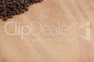 Coffee beans on wooden table