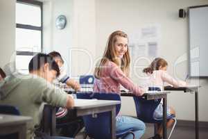 School kids doing homework in classroom