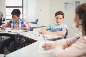 Students studying in classroom