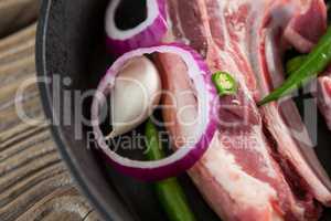 Blade chop and chopped chillies and onions in frying pan