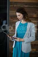 Female business executive using digital tablet