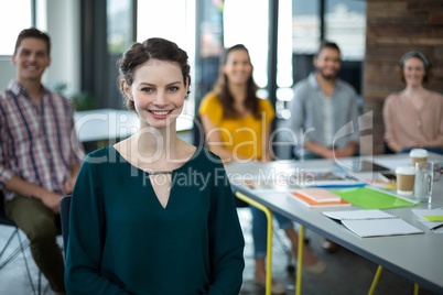 Smiling graphic designers sitting in office