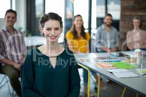 Smiling graphic designers sitting in office