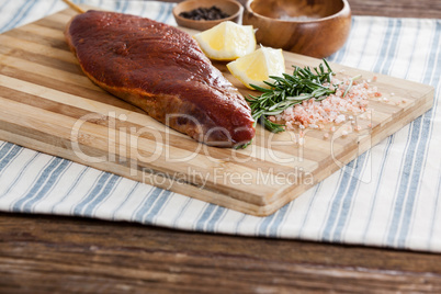 Beef steak and ingredients on wooden board