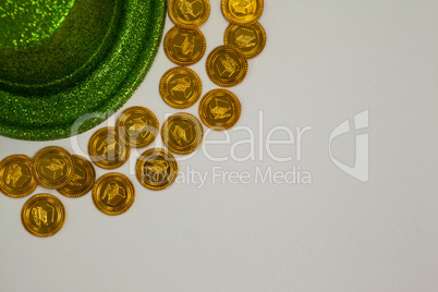 St Patricks Day leprechaun hat surround with gold chocolate coins