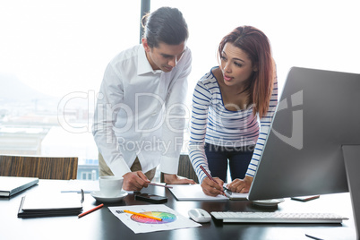 Man and woman working in office