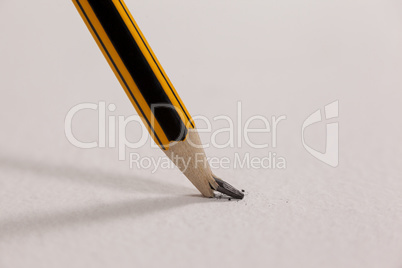 Broken pencil on white background