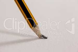 Broken pencil on white background