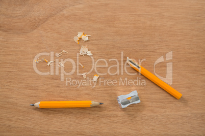 Broken yellow pencil with sharpener