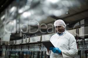 Factory engineer using digital tablet in the factory