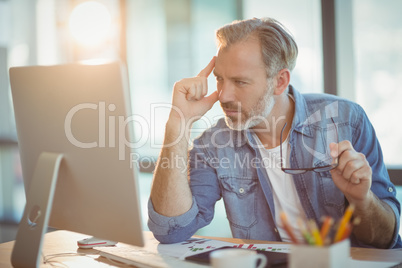 Male graphic designer working on computer