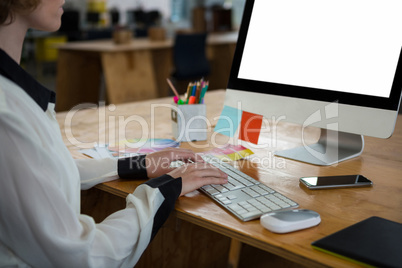 Female graphic designer working at desk