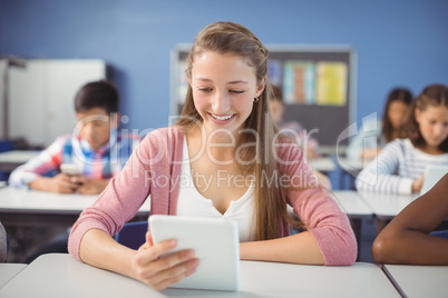 Student using digital tablet in classroom