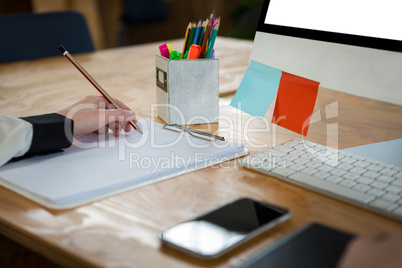 Female graphic designer working at desk