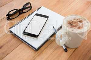 Coffee with organizer and mobile phone
