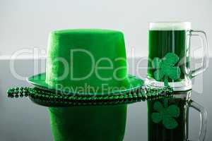 St Patricks Day green beer with shamrock, leprechaun hat and bead