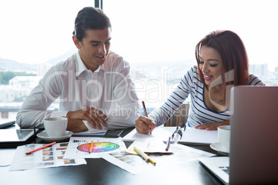 Man and woman working  in office