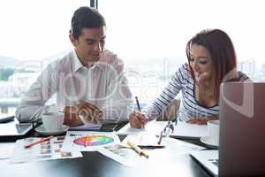 Man and woman working  in office
