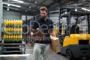 Factory staff looking at clipboard