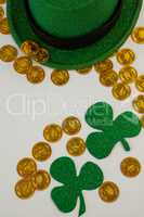 St. Patricks Day leprechaun hat, shamrocks and chocolate gold coins