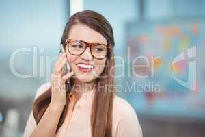 Female business executive talking on mobile phone