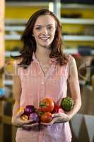 Woman holding vegetables at grocery store