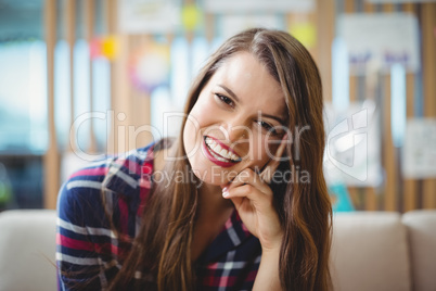 Smiling female business executive in office