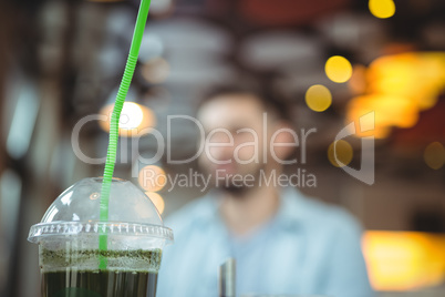 Close-up of juice in disposable glass