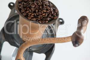 Vintage coffee grinder with coffee beans