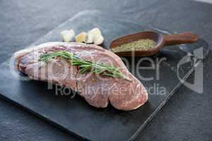 Sirloin chop, spics and garlic on slate plate