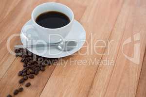 Black coffee with roasted coffee beans